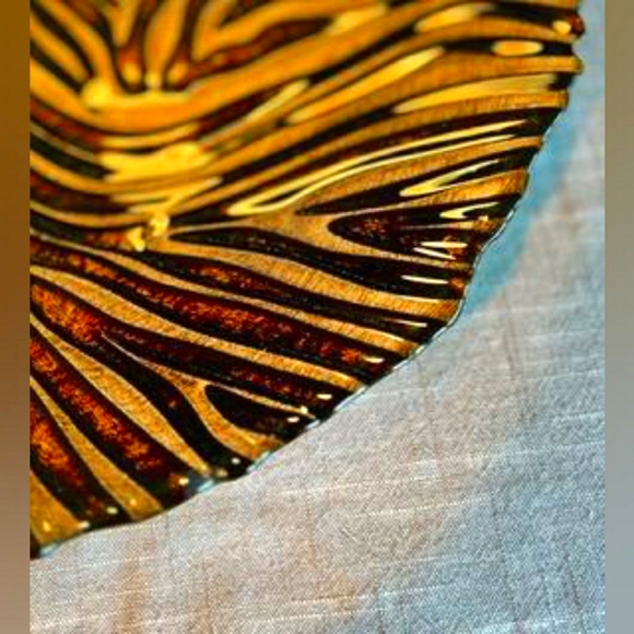 Black and gold zebra patterned ceramic platter.